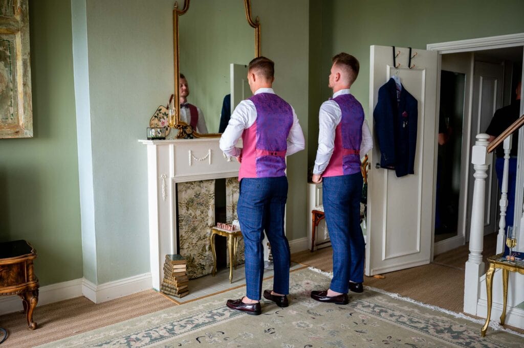 two grooms getting dressed for their Brighton Wedding
