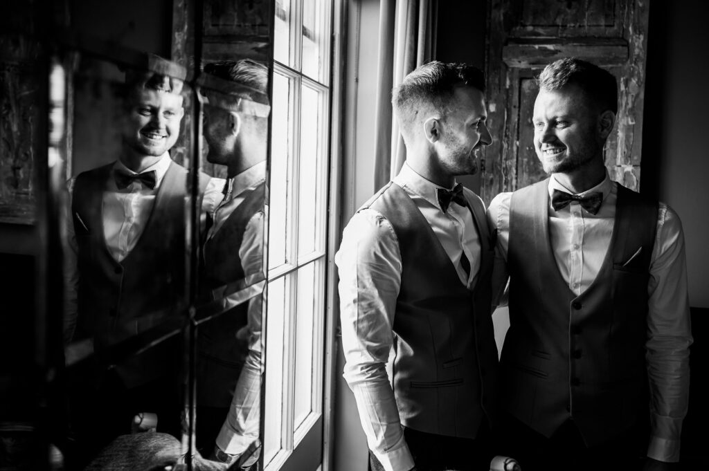 two grooms gazing lovingly at each other 