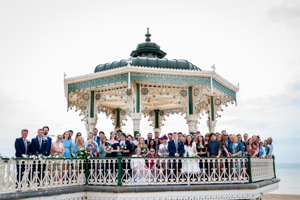 all the wedding guests at the Brighton Bandstand before they left for the Brighton Beach Party Wedding