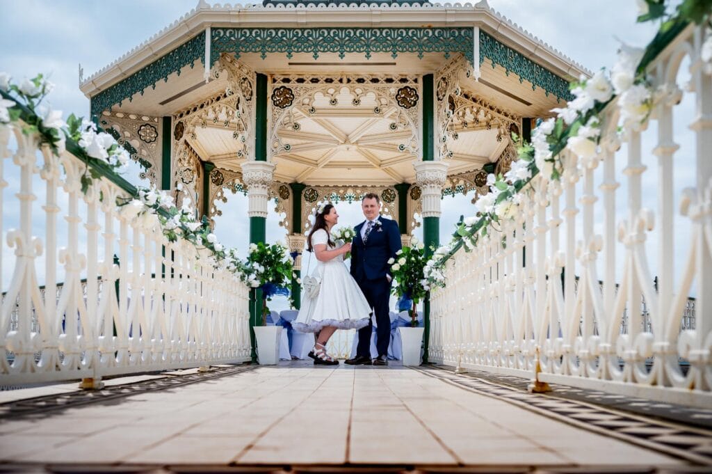 cute couple getting married at Brighton Bandstand for their Brighton Beach Party Wedding